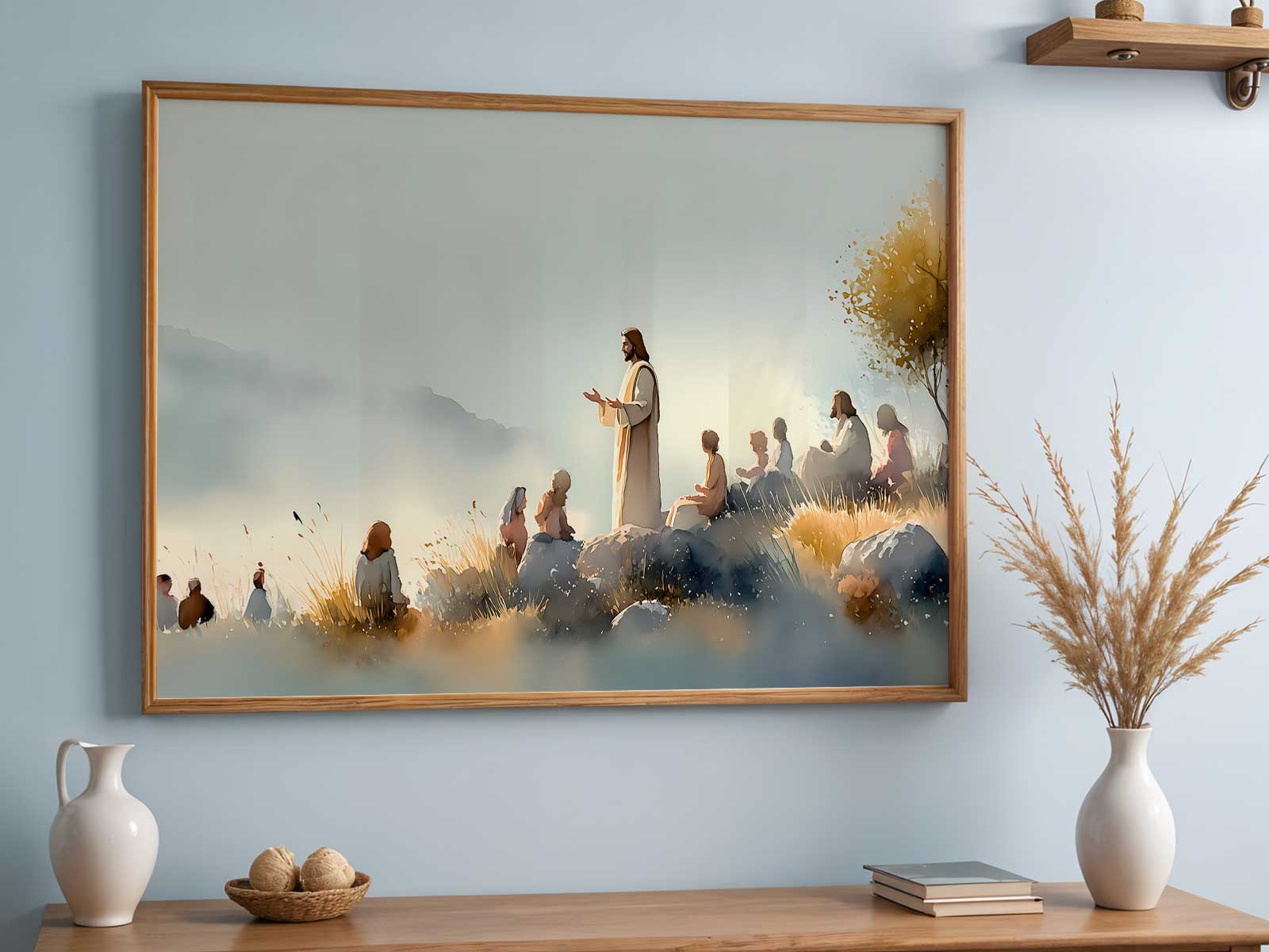 Hand-lettered Beatitudes poster in muted blue and cream leaning on a shelf with plants